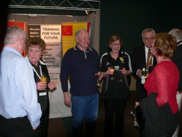 Happy hour on Friday evening. They just happened to be standing in front of the AITC and ETITO banners